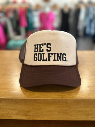 He's Golfing Trucker Hat